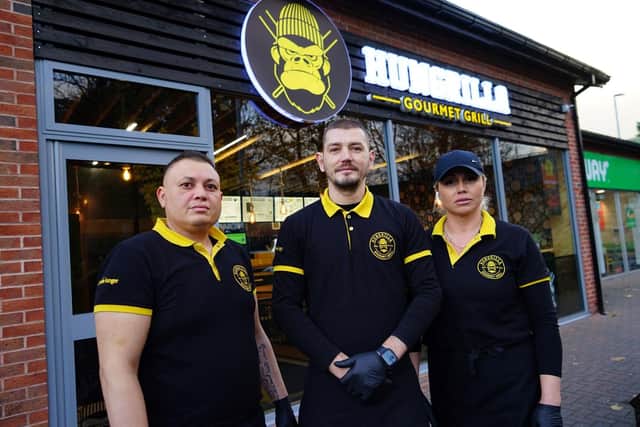 Staff outside Hungrilla Gourmet Grill restaurant in Mansfield Woodhouse.