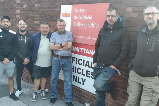 Union rep Dave Naylor (second from right) with fellow strikers on the picket line outside the Royal Mail delivery office in Sutton.