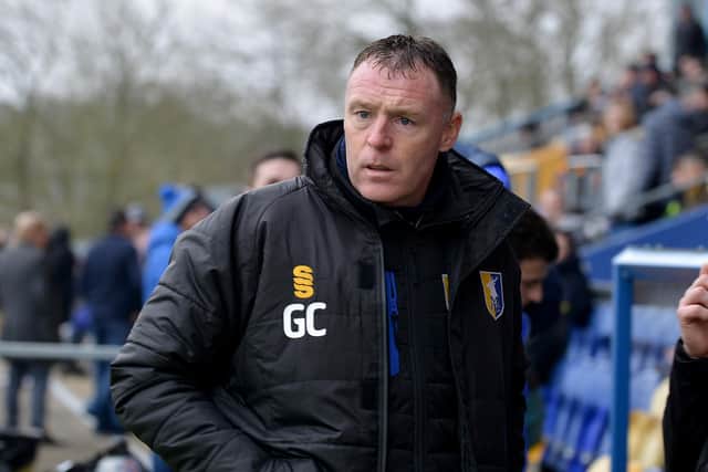 Mansfield manager Graham Coughlan has been informed his whole team and backroom staff will require testing