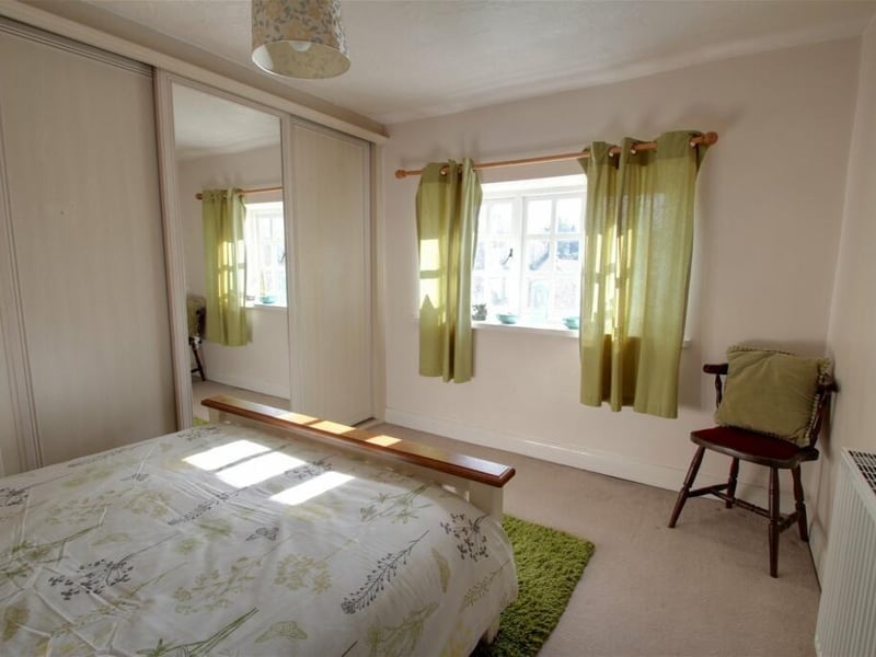 All the other bedrooms at the house are well maintained and presented, including this one which benefits from built-in wardrobes. It overlooks the front of the property.