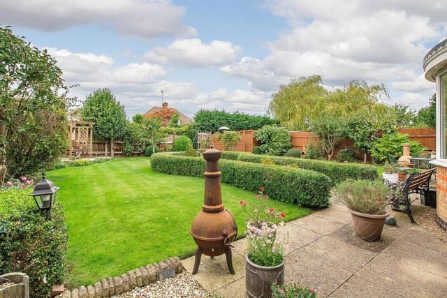 The back garden could hardly be more attractive. As well as a lawned area, it includes a feature gravel section with a block-paved border, enclosed by a low hedgerow.