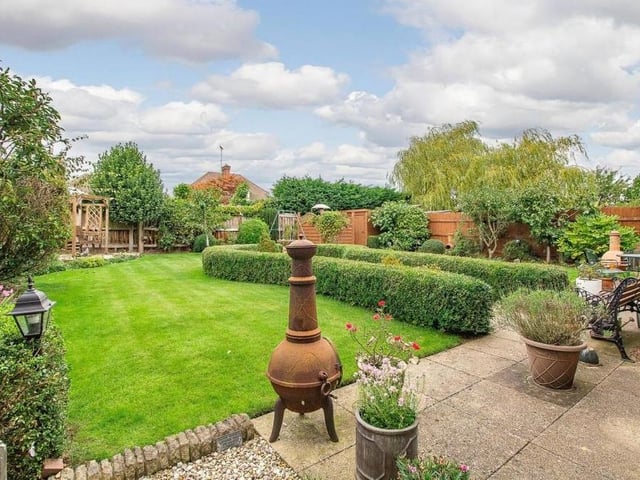 The back garden could hardly be more attractive. As well as a lawned area, it includes a feature gravel section with a block-paved border, enclosed by a low hedgerow.