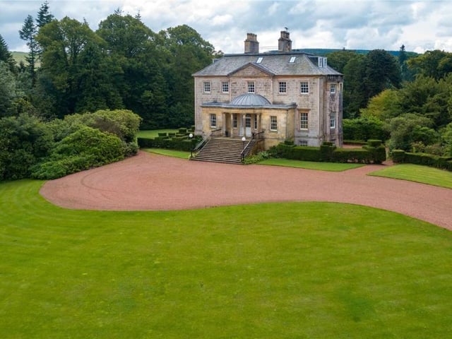 Driveway and parking area in front of house.