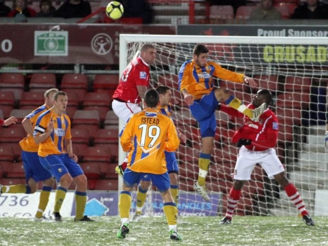 Mansfield on the attack as Steve Istead waits on the edge of the box.