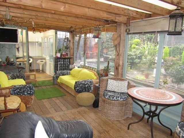 A third shot of the colourful garden room, which has access to the utility room and side porch area.