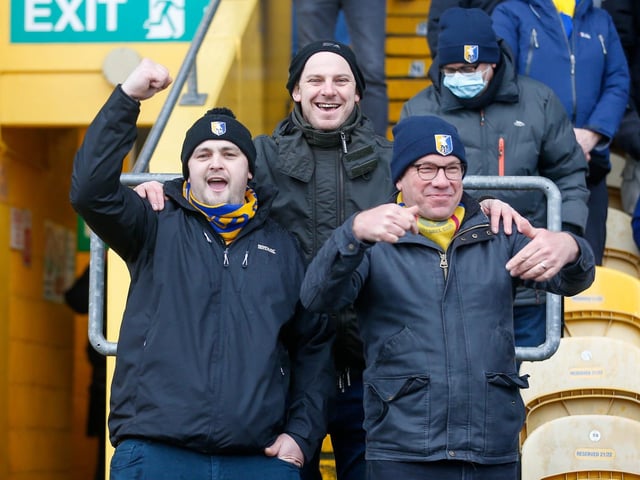 Mansfield Town fans at the One Call Stadium for the Emirates FA Cup third round match against Middlesbrough.