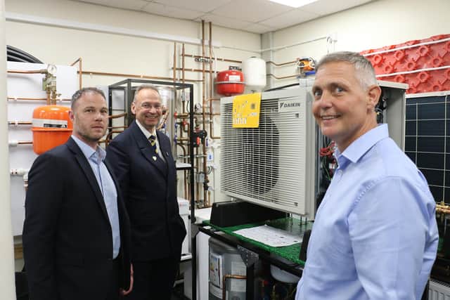 NAPIT’s head of training Brett Forster (first right) and commercial and compliance director Stephen Melton (first left) show college principal Andrew Cropley one of the custom-built rigs at the company’s Mansfield Training Centre.