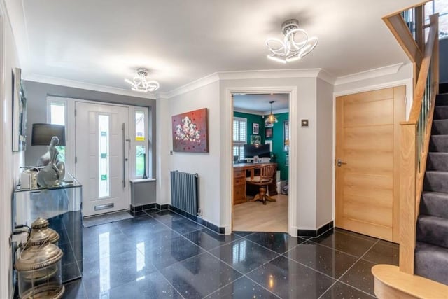 Once through the front door, you are greeted by this inviting entrance hall, with its large quartz-tiled floor. Leading to most of the main rooms on the ground floor, it also includes a modern aluminium radiator and coving to the ceiling.