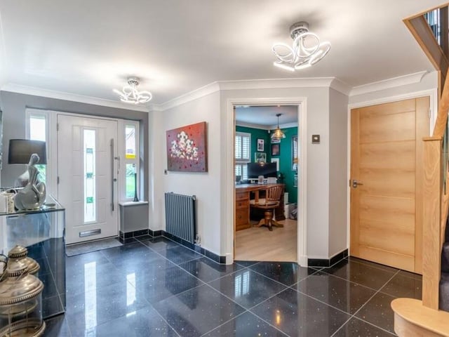 Once through the front door, you are greeted by this inviting entrance hall, with its large quartz-tiled floor. Leading to most of the main rooms on the ground floor, it also includes a modern aluminium radiator and coving to the ceiling.