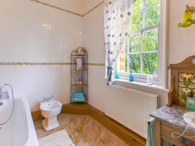 You have to love the marble wash stand and hand wash basin in the family bathroom, don't you? There is also a fitted bath with shower attachment, bidet and Amtico flooring.