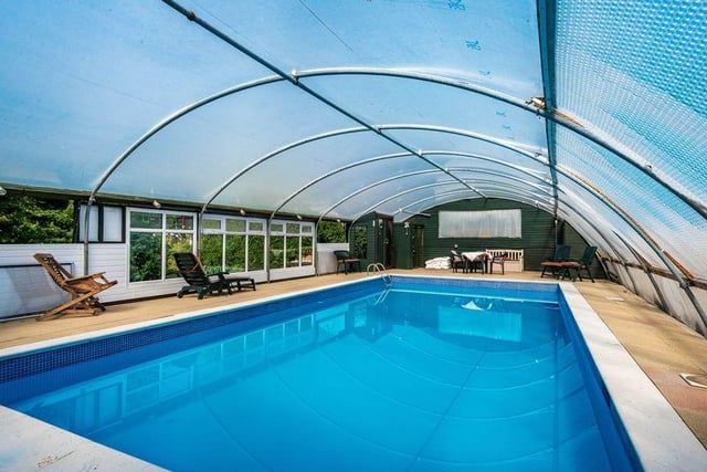 The swimming pool is located to the rear of the property on Long Lane, Banks, Southport.