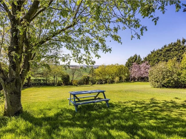 The garden has been designed to make the very most of the exceptional plot and panoramic views and is mostly laid to lawn