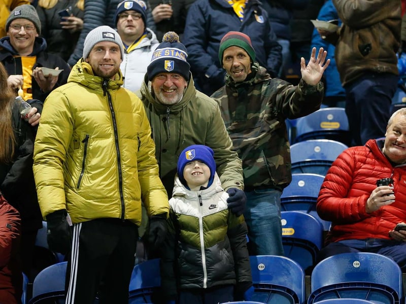 Mansfield Town's faces in the crowd against Swindon Town.