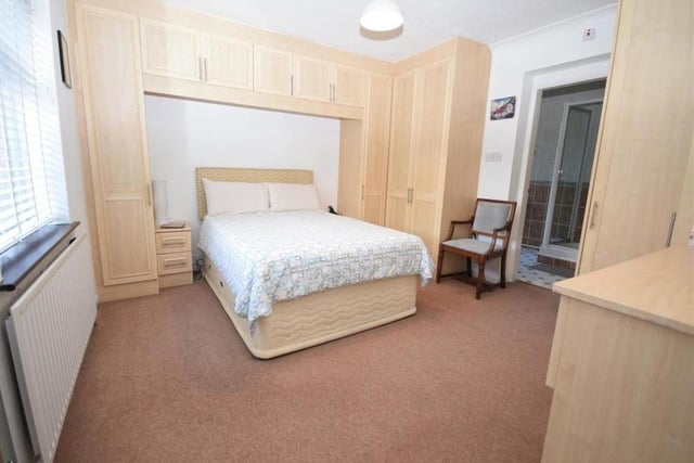 Here is another bright and spacious bedroom, again with plenty of wardrobe and storage space. Spot the en suite to the right.