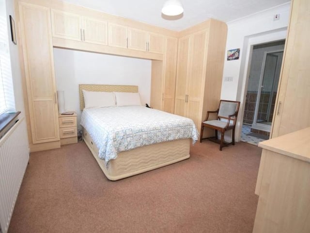 Here is another bright and spacious bedroom, again with plenty of wardrobe and storage space. Spot the en suite to the right.