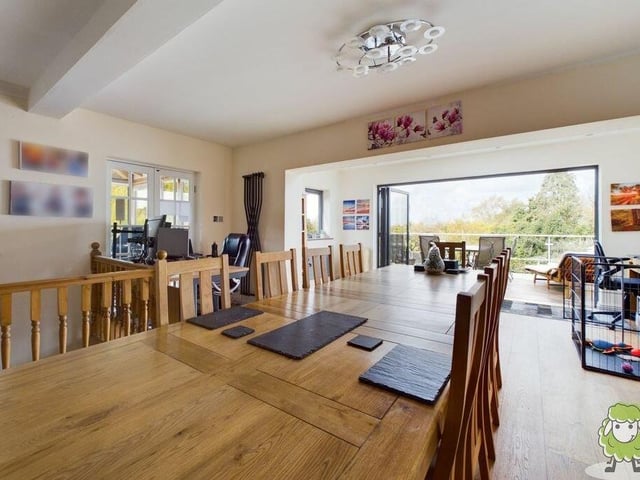 Next stop is the dining room, which is part of an open-plan layout next to the kitchen. It has easy access to a balcony, via high-end Origin bi-fold doors.