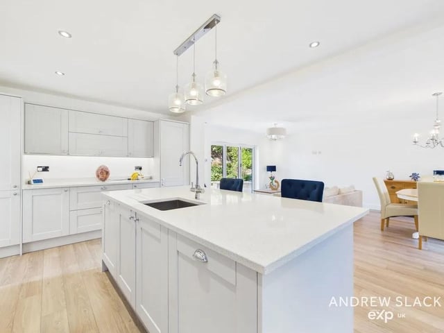 Nestled on one of Mansfield’s most prestigious addresses, this exceptional five-bedroom detached residence offers an impressive 2,720 sq ft of beautifully modernised living space, secured behind a private gated entrance. The heart of the home is the striking, fully modernised kitchen featuring quartz worktops, a generous island, skylights and high-end appliances—perfect for relaxed family dining or entertaining guests.