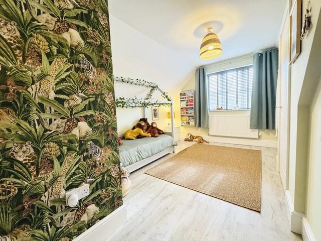 The property features five bedrooms, perfect for a growing family.