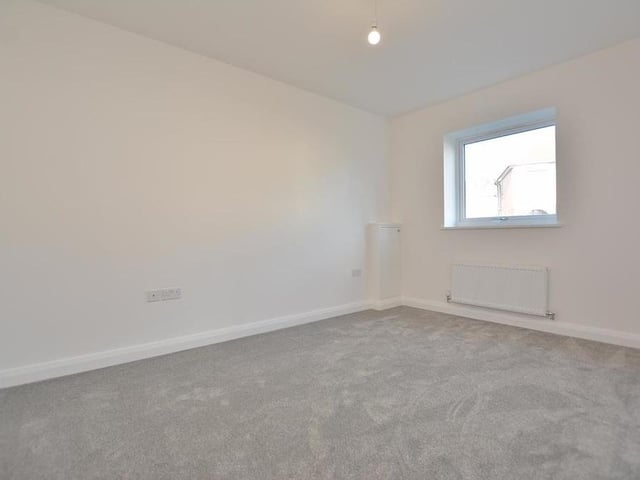 Bedroom number two is also a fine size. It includes a cupboard housing the consumer unit, plus a radiator, four double power points, a TV point and a double-glazed window to the front of the £250,000 property.