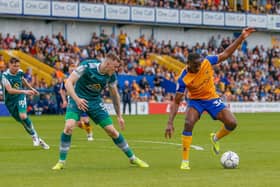 Mansfield Town forward Lucas Akins under pressure from a Sutton. Photo by Chris Holloway/The Bigger Picture.media.
