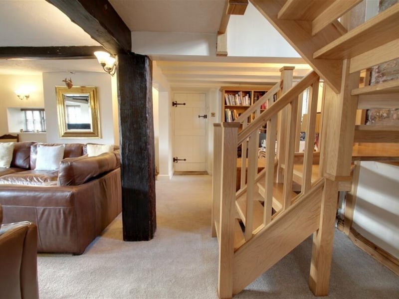 A door from the lounge gives access to the garage and bar, while an oak staircase leads to the first floor, which is where we are heading next.