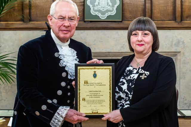 Yvette gets her award from High Sheriff of Nottinghamshire Nick Ebbs