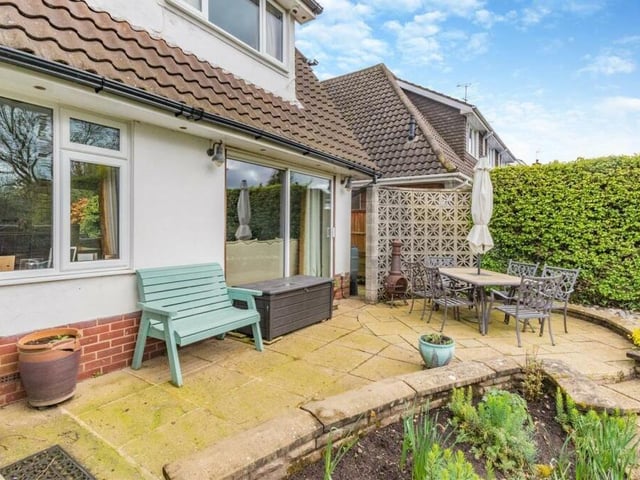Here is a close-up of a raised, paved patio at the back of the house. There is an additional patio at the side, plus a further cobbled patio and stone path at the bottom of the rear garden.