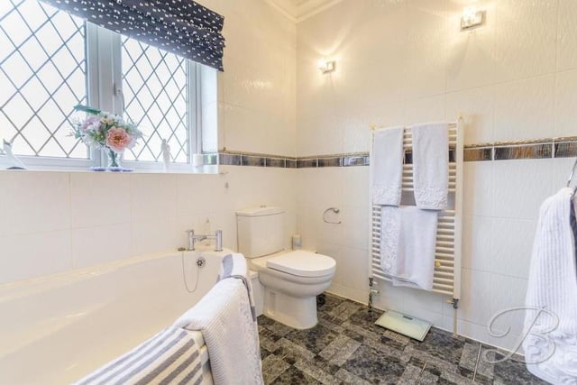 Here is an en suite bathroom on the ground floor of the Nottingham Road house which could prove handy if the lounge is turned into a bedroom. A four-piece suite includes a corner panelled bath, low-flush WC, heated towel-rail, tiled flooring and floor-to-ceiling downlights.