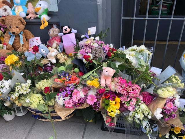 Hundreds of flowers and toys have also been laid with messages of condolences