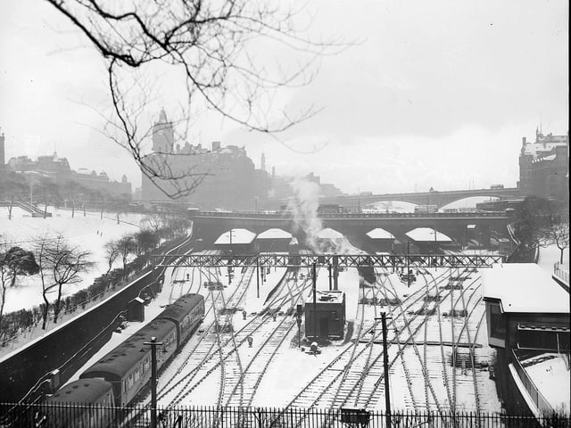 A view of Waverley Station in the snow, with the North British Hotel in the background, in 1960.