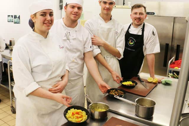 Professional cookery students with Leigh Richards and their culinary creations.