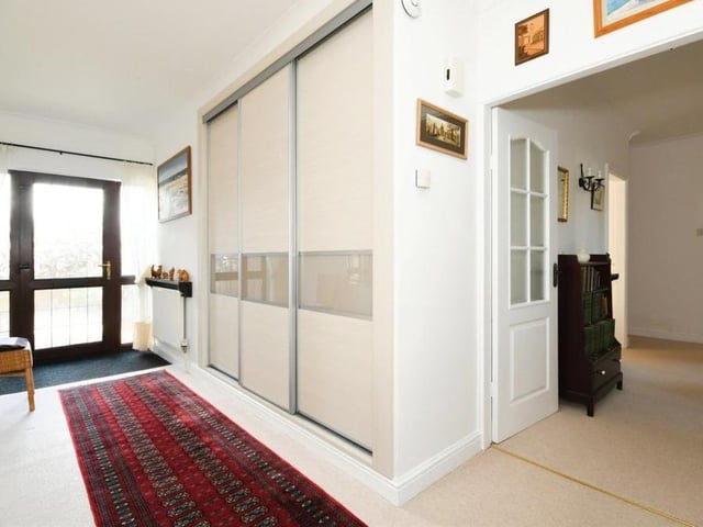 We begin our photo tour of the bungalow in this light and airy entrance hallway. Behind the sliding doors you can see is a store for coats and shoes.