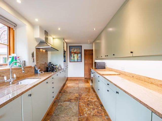 The breakfast kitchen boasts a range of modern fitted units, full of clever storage solutions, as well as essential integrated appliances.