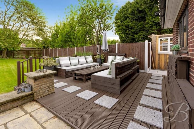 After traipsing round the house and grounds, how about a sit-down with a glass of wine or cup of tea? This raised, decked area looks ideal!
