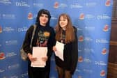 Olivia Sharpe and Amelia Sikora collecting GCSEs at Queen Elizabeth's Academy
