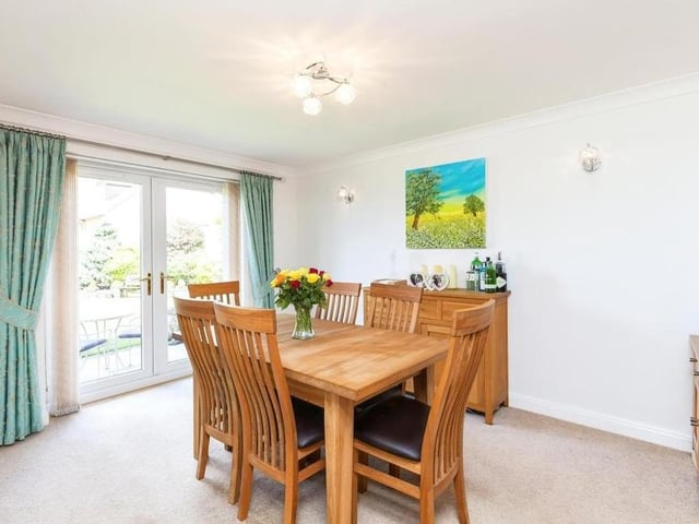 The Underwood property's dining room is a delightful space, with a carpeted floor and uPVC double-glazed French doors leading out to the stunning back garden.