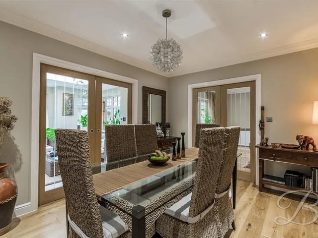 The perfect place for a family meal or dinner party featuring engineered wooden floors, central heating radiator, coving, downlights and sliding pocket doors providing access to the kitchen and orangery.