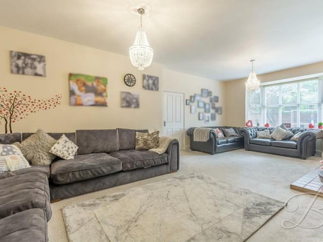 The fabulous lounge or living room is the biggest room in the bungalow. It blends space with style and comfort, and is also bright, thanks to a bay window at the front of the property and multiple windows to the side too.