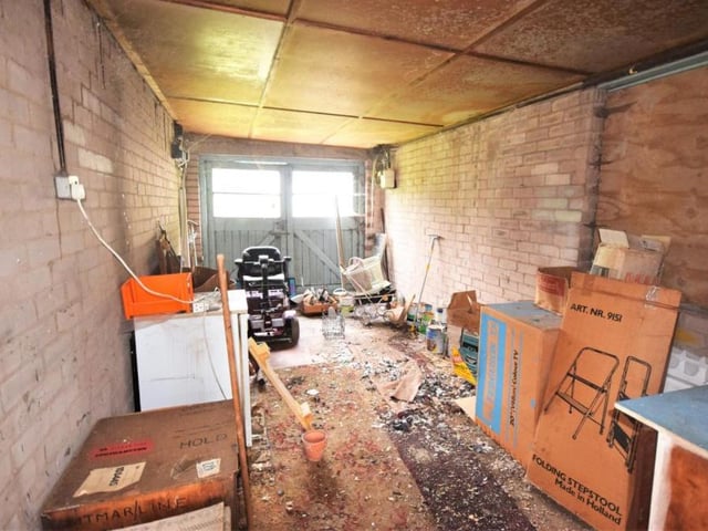 The garage is surprisingly sizeable. It boasts double doors, power and light.