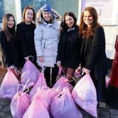 Staton & Cushley estate agents delivered free toys and clothes to the Lashes HQ charity shop, from left Emma Wilson, Danielle Rawlinson, Shanelle Marasli, Pippa Graves and Emma Rawlinson.