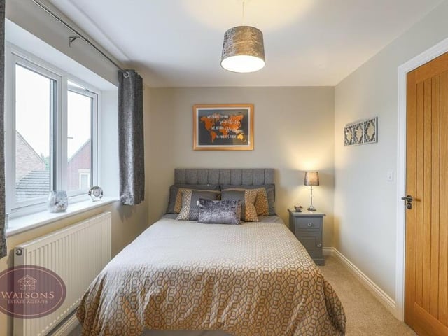 Bedroom number three at the £700,000 Selston property faces the front of the house and also has access to the shared en suite shower room.