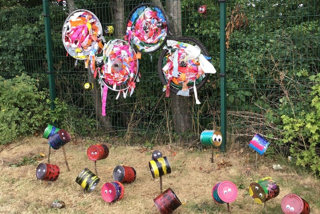 Year 1 used baked bean tins to create insects and bike wheels to create flowers.