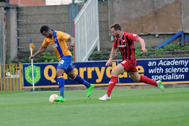 Johnny Mullins faces Mansfield Town during his time with Oxford.