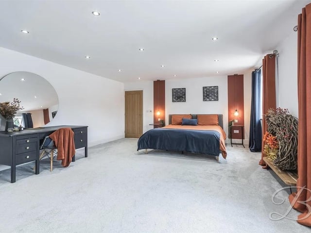 A luxurious and tranquil space complete with carpeted flooring, central heating radiator and windows to the side elevation. This room further benefits from a walk in wardrobe and its own en-suite facility.