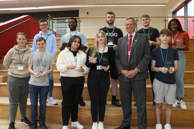 Principal and chief executive Andrew Cropley (front, second right) congratulates student award-winners and event organisers.