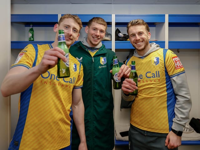 Mansfield Town's fans and players celebrated promotion to League One long into the night.
