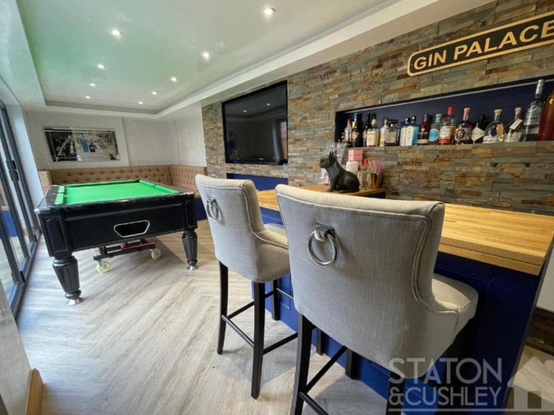 Well, you've waited for it long enough! Here is the famed games room and bar, the self-proclaimed 'Gin Palace', at the Sorrel Drive property. As you can see, there is room for a snooker or pool table and large TV screen