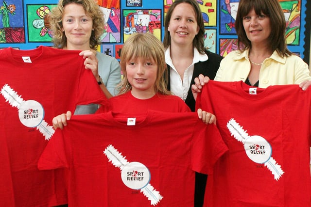 2006: Nuthall pupil Damian Smith is presented with a t-shirt he designed for a Severn Trent competition.