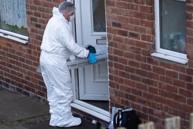 Police forensics search a house in Warsop, after a man aged 33 was arrested on suspicion of murder.