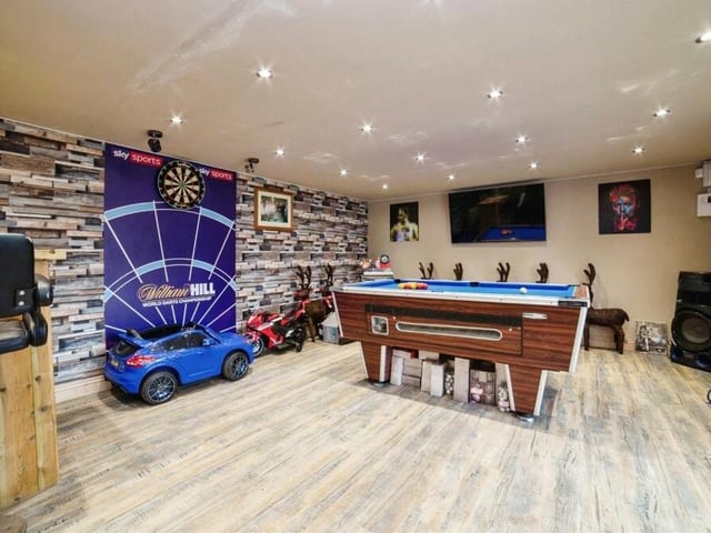 Inside the spacious garden 'man cave' at the moment is a pool table, dartboard and bar.